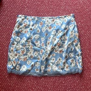 More to Come super cute floral/coastal blue skirt with lace detail on the bottom